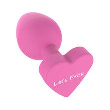 Plug anal TOYJOY Anal Play Booty Sweethearts, cu mesaj „Let’s Fuck” pe baza în formă de inimă, diametru 3.5 cm, roz