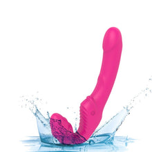 Vibrator dublu TOYZ4LOVERS Elys Love Gun, strap-on fără ham, control prin telecomandă, cu vibrații multiple, 21.8 cm, roz