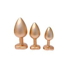 Set plug anal DREAMTOYS Pearl Gold Plug, 3 dopuri de dimensiuni progresive, 7.1 cm - 9.5 cm, cu baze în formă de inimă, auriu