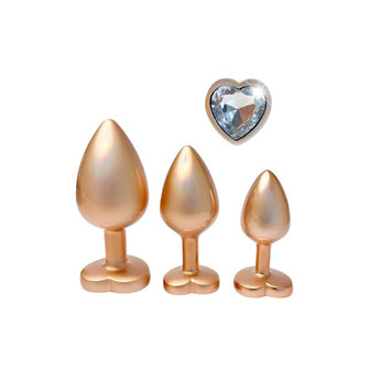 Set plug anal DREAMTOYS Pearl Gold Plug, 3 dopuri de dimensiuni progresive, 7.1 cm - 9.5 cm, cu baze în formă de inimă, auriu