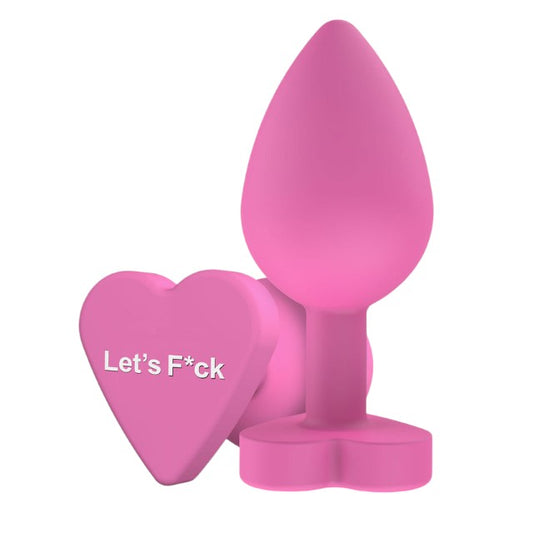 Plug anal TOYJOY Anal Play Booty Sweethearts, cu mesaj „Let’s Fuck” pe baza în formă de inimă, diametru 3.5 cm, roz