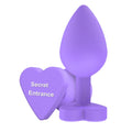 Plug anal TOYJOY Anal Play Booty Sweethearts, cu mesaj „Secret Entrance” pe baza în formă de inimă, diametru 3.5 cm, mov