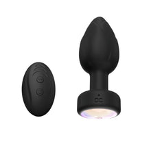 Vibrator anal TOOSH Light Up Vibrating Butt Plug, cu telecomandă, led multicolor, 10 funcții de vibrație, din silicon, 7.6 cm inserabili, negru